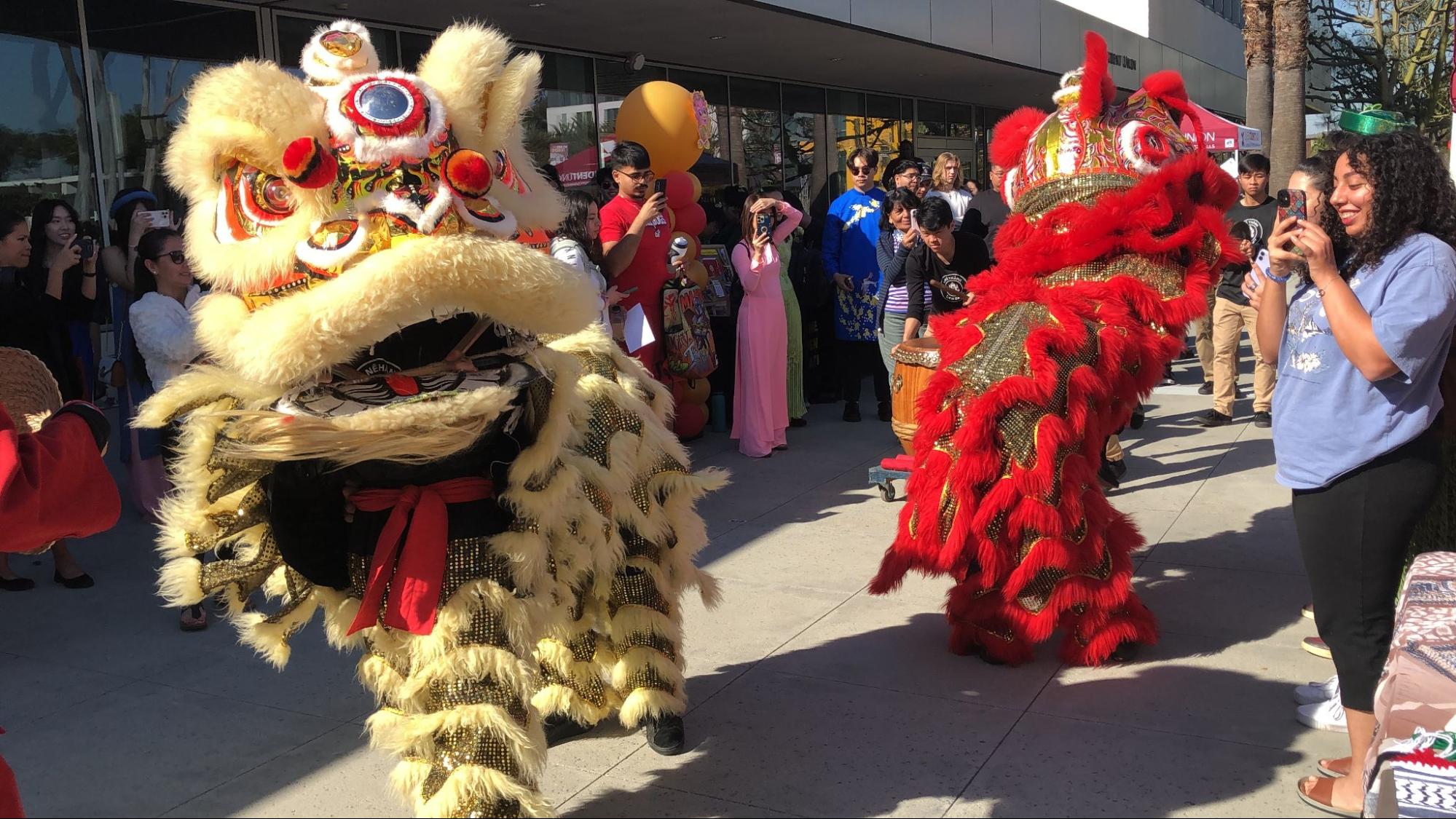 Photo of big gold and red dragon dancing puppets.