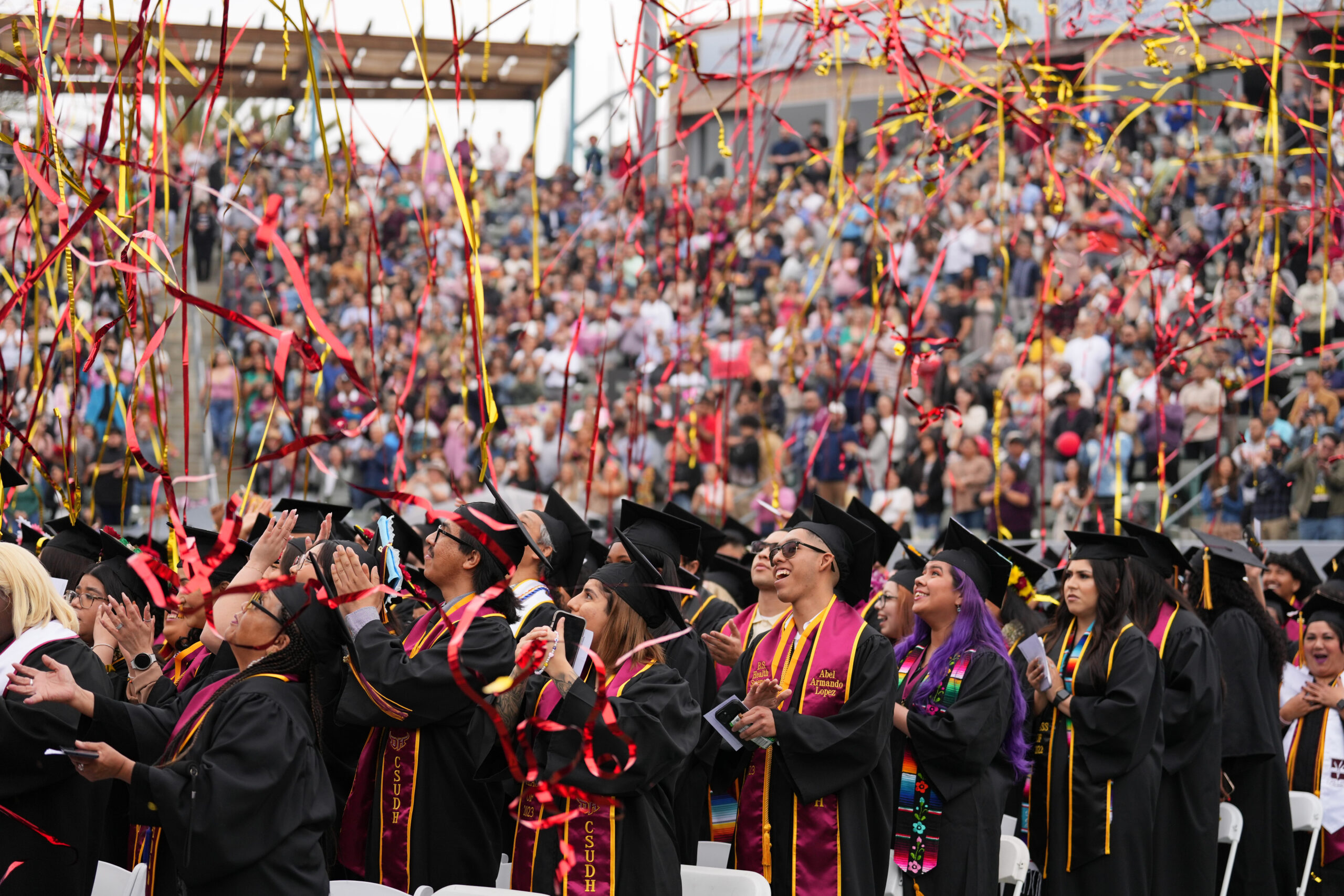 California State University-Dominguez Hills students celebrating during the 2023 graduation ceremony.